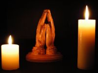 praying%20hands%20by%20candlelight
