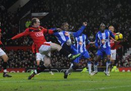 Rooney skora fyrsta  mark gegn Wigan